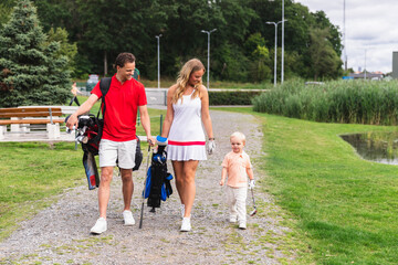 Family with Son Approaching Golf Field to Start Practice Together