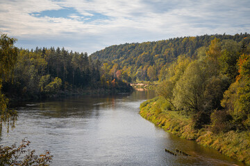 Autumn Color Reflections at the River. A view of the river in the valley. Autumn day..