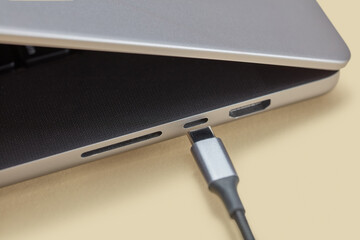 Micro usb wire attaching to connector in laptop with aluminum case