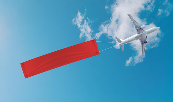 plane flying in clear blue sky is towing large red banner, creating striking visual against clouds. scene captures sense of adventure and promotion.  promotion sale advertising banner