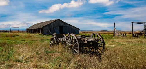 Vintage freight wagon and abandoned barn near Frenchglen Oregon