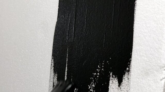 white wall painted black with a roller