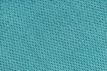 Texture of turquoise jacquard fabric of diagonal rough weave cloth structure macro background