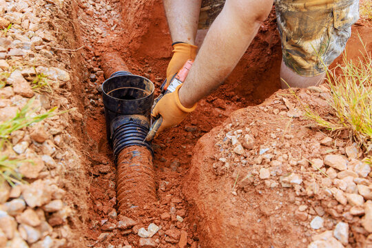 An underground storm sewer pipe has been replaced to replace damaged drainage system for collecting rainwater.