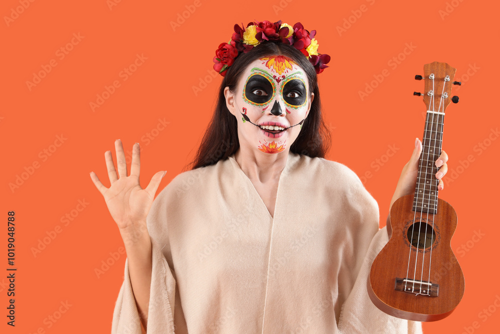 Sticker Surprised young woman dressed for Halloween with guitar on orange background