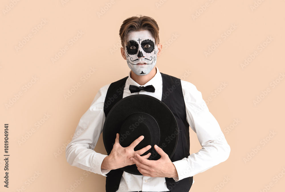 Poster Shocked young man dressed for Halloween on beige background