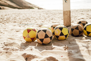 Colorful Soccer Balls on Sandy Beach