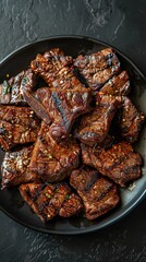 Juicy grilled beef steak served on a black plate at a dining table ready for enjoyment