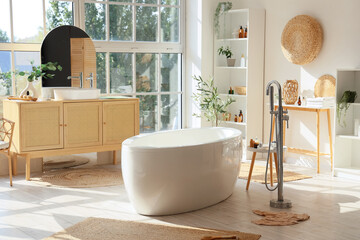 Stylish bathtub with commode and big window at home