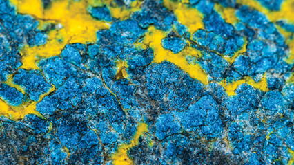 Vibrant Blue and Yellow Mineral Deposit Texture.