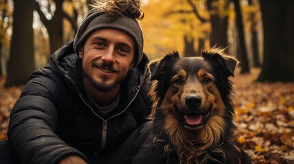 Selfie picture of a young happy man walking his dog in a park , smiling guy and pet having fun together outdoor , friendship and love between humans and animals