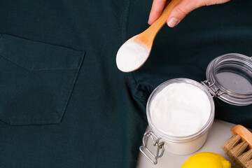 Natural ingredients baking soda, vinegar, lemon juice to remove sweat stains under the armpits on...