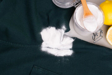 Natural ingredients baking soda, vinegar, lemon juice to remove sweat stains under the armpits on...
