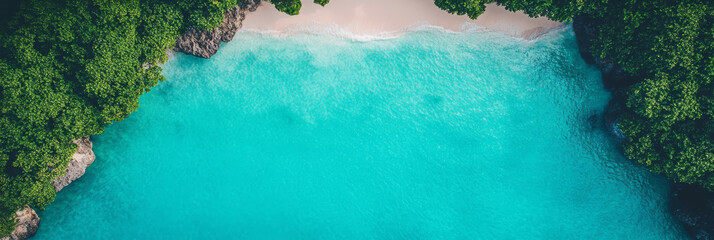 Aerial view of a secluded beach with turquoise water and lush greenery.