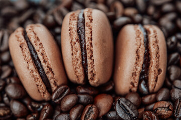 Macaroons and roasted coffee beans.Coffee Desserts and Pastries.Brown Macarons. Coffee macaroons.pastries with coffee aroma.French Delicious Pastries kit 