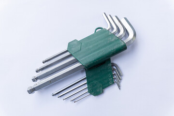 A set of hex keys, also known as Allen wrenches, in a convenient green plastic holder.