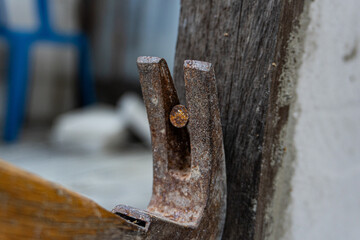 Rusty Hammer and Nail on Wooden Board, Vintage Tool Close-up