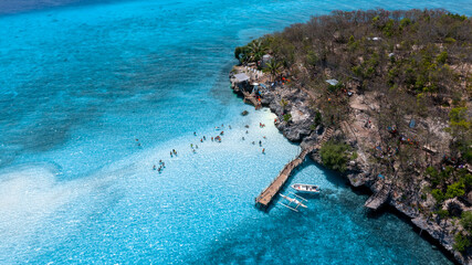 Aerial view of Sumilon Island, Oslob, Cebu, Philippines, White sand beach and seashore at Sumilon island beach, Sand beach clear sea water of the Sumilon Island, Oslob, Cebu, Philippines.