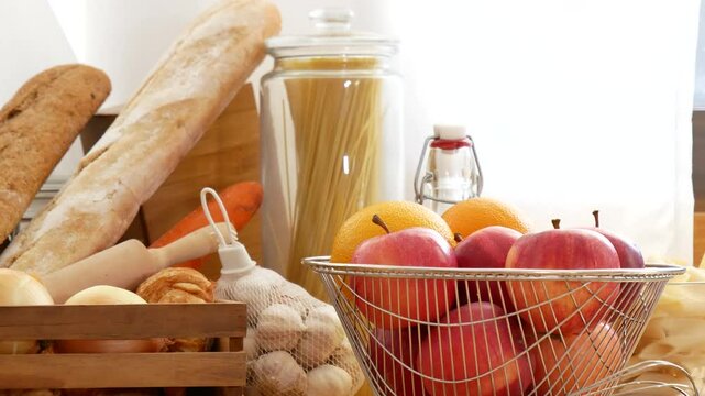 Kitchen background home interior bright simple decorate with bread garlic apple oil Preparing food meal. Warm home interior defocused mockup food shelf living space. Home showcase kitchen restaurant