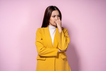 A woman in a yellow jacket is looking away from the camera