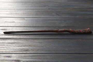 One old magic wand on wooden table