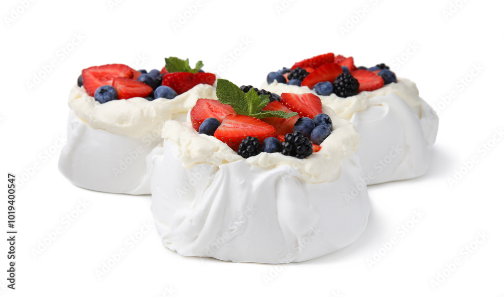 Poster Pavlova cake (meringue dessert) with whipped cream, fresh berries and mint isolated on white