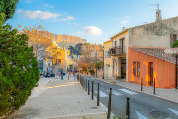 View from one of the hillside streets leading to the old town of the limestone Mont Puget mountain,...