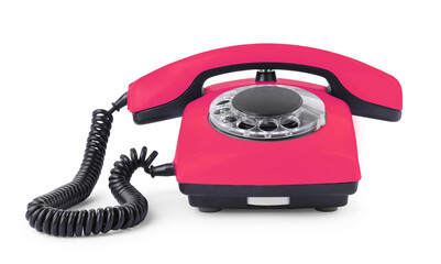 Old pink telephone with rotary dial isolated on white