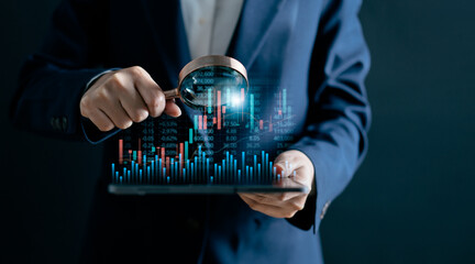 Businesswomen use magnifier glass find stock in stock markets, uptrends, growth economics, business...