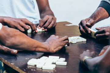 Friends Playing Dominos game Outdoors in Cuba