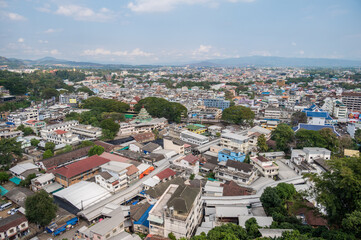 Obraz premium Tachileik town seen from the mountain in Mae Sai district of Chiang Rai province of Thailand. Tachileik is a border town in Shan State of eastern Myanmar.