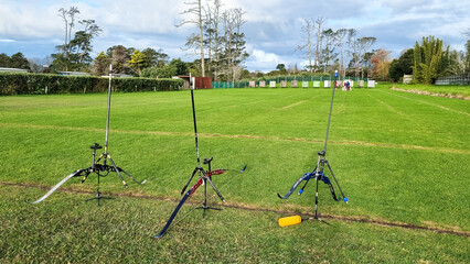 Bows standing on an outdoor archery range