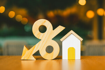 The house model and the percentage symbol model with a downward pointing arrow are an idea of...