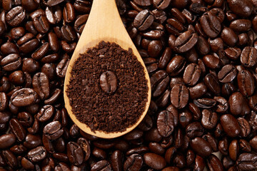 Coffee beans in wooden spoon, creative photography top view