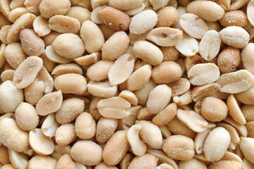 Salted peanuts texture background. Healthy dietary food.