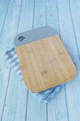 wooden chopping board on table with copy space 