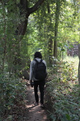 Fototapeta premium man walking in the forest