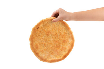 hand holding a naan bread on white background.  Traditional food in Xinjiang, China