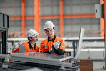 Factory metal workers install solar panels, cut costs, earn carbon credits, combat climate change.