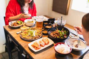 Family Enjoying Lunch Together at Korean Asian Restaurant