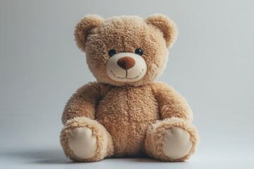 Obraz premium soft plush teddy bear sitting against a crisp white background exuding warmth and comfort ideal for childrens themes and nostalgic memories