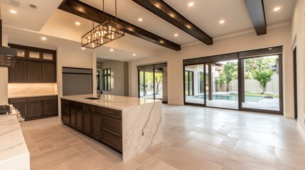 Modern kitchen and living area with large windows and a pool view.