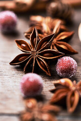 Star anise with cinnamon. Christmas spices on rustic wooden background. Close up.