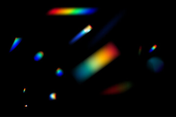 Dynamic lens flare and rainbow prism effect on transparent background. Rainbow light rays, lens flare, reflection effect from crystal, glass or gem. Blur colorful rainbow crystal light leaks.