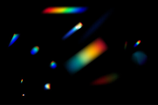 Dynamic lens flare and rainbow prism effect on transparent background. Rainbow light rays, lens flare, reflection effect from crystal, glass or gem. Blur colorful rainbow crystal light leaks.