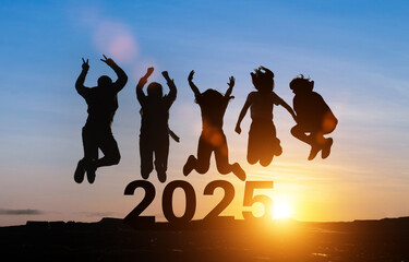 Happy group of people celebrate jump for new year 2025. concept for win victory. silhouette of...