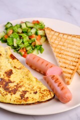 Breakfast Plate with Eggs, Vegetables, and Sausages