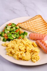Breakfast Plate with Eggs, Vegetables, and Sausages