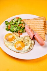 Breakfast Plate with Eggs, Vegetables, and Sausages