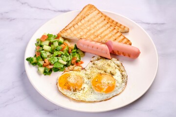 Breakfast Plate with Eggs, Vegetables, and Sausages